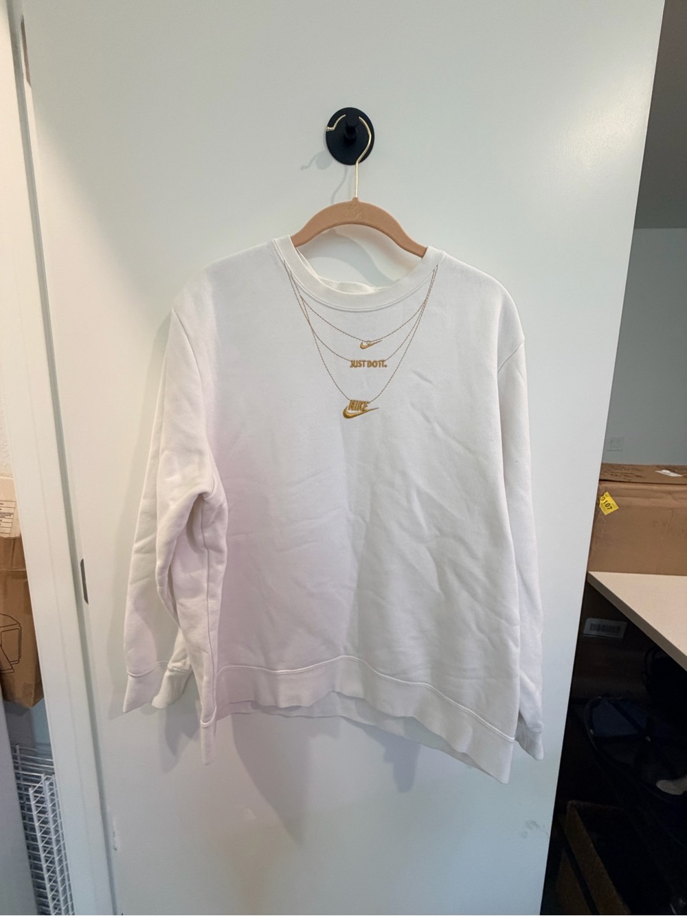 Nike White Sweatshirt with Gold Swoosh and Text Accents